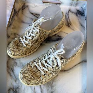 Joseph Siebel Caspian sneakers in snake print leather are available in size 40.